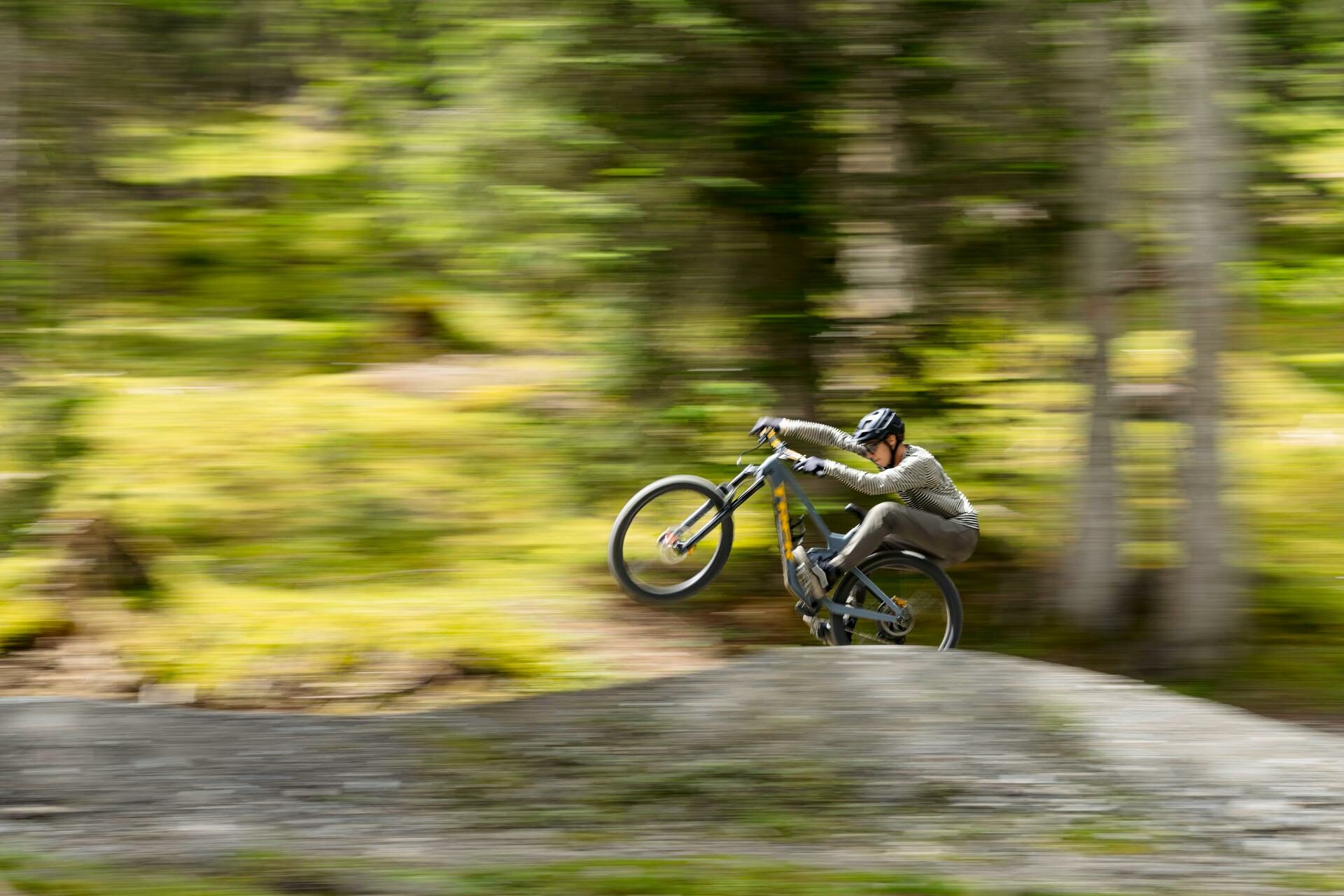 Biker rides on the rear wheel